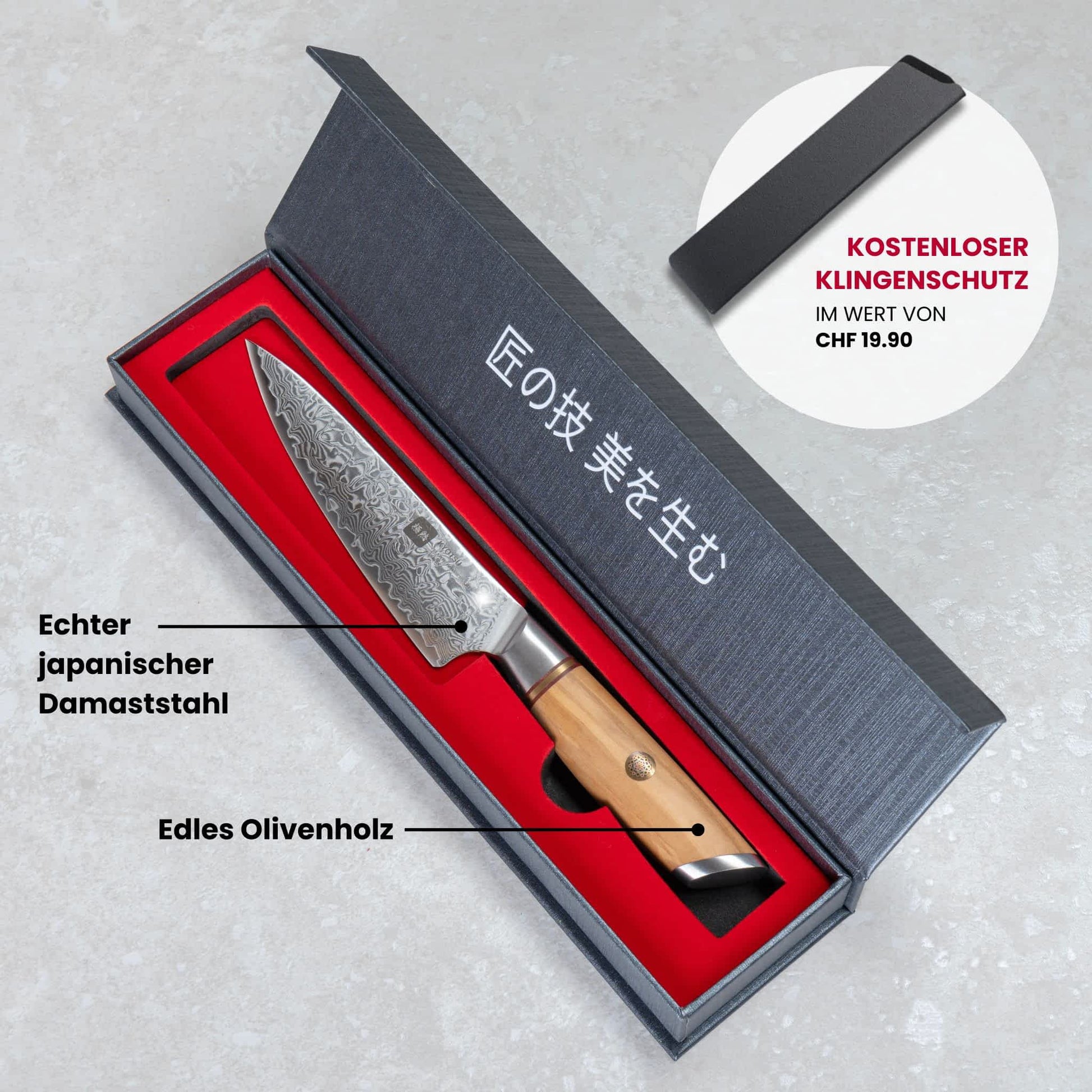 Kyotsu Allzweckmesser aus Damaststahl in geöffneter Verpackung – daneben Deckel und frisch geschnittene Apfelhälften.