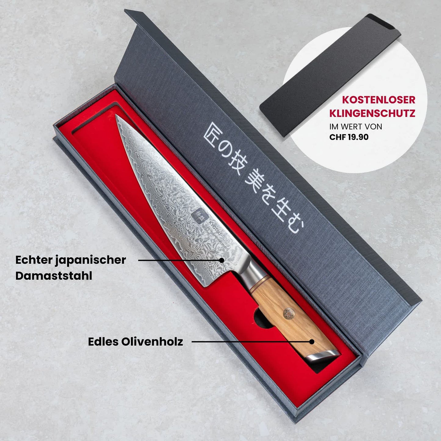 Kyotsu Chefmesser aus Damaststahl in geöffneter Verpackung.